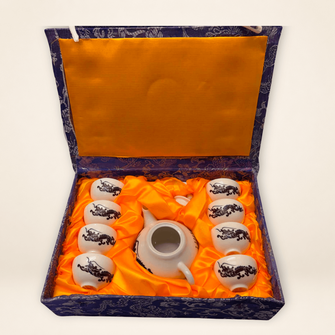 Chinese miniature tea set with black dragon design, eight cups and presentation box