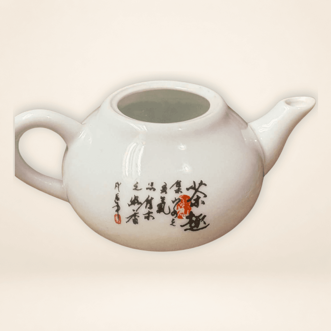Reverse of Chinese miniature teapot with black calligraphy and red seal detail