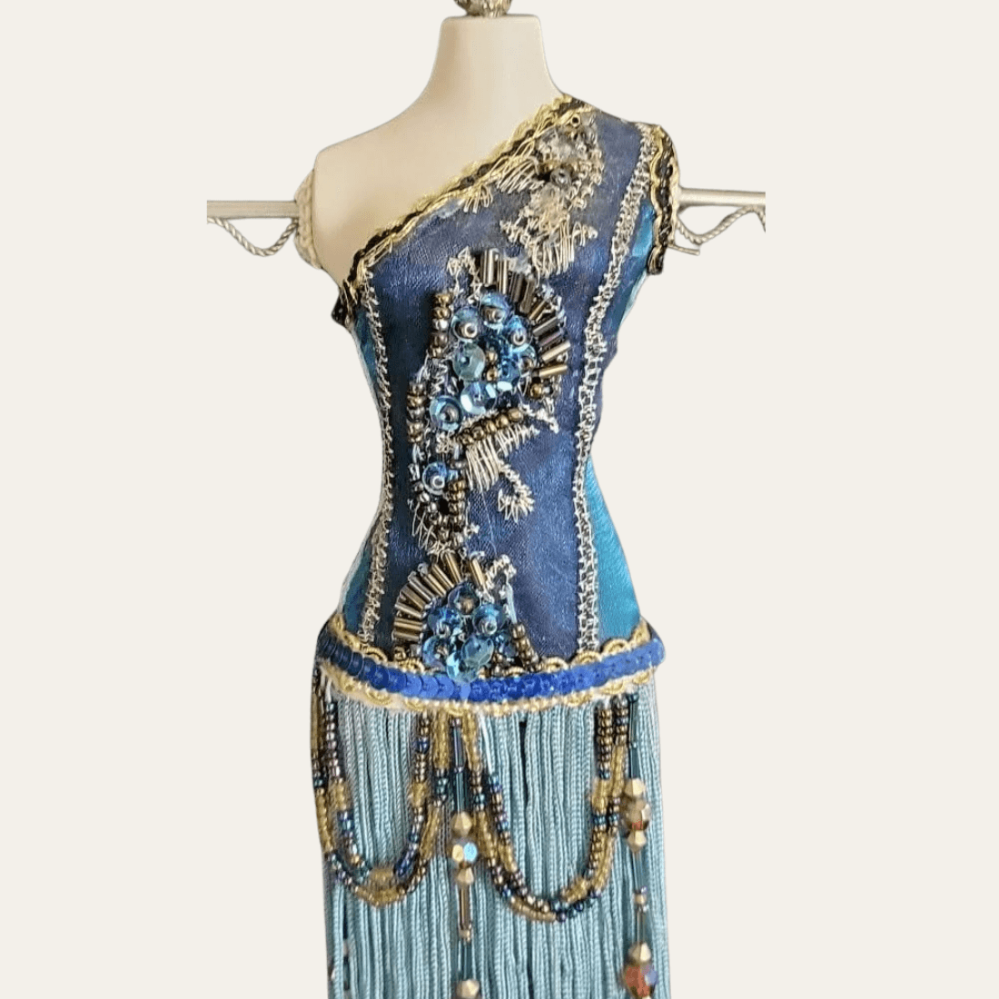 Beaded blue bodice detail on mannequin jewellery stand