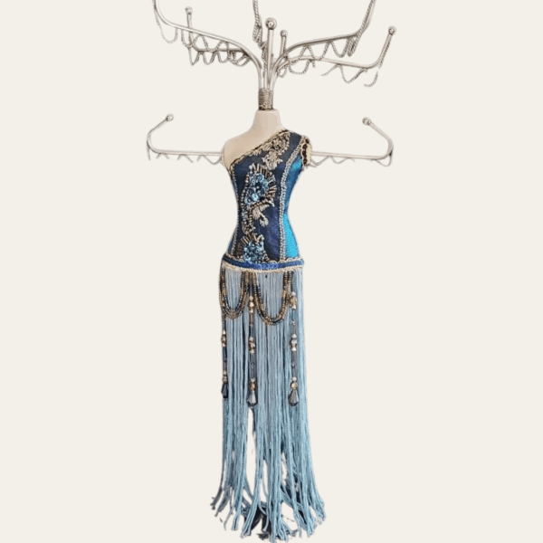 Blue beaded mannequin jewellery stand with silver-tone metal hooks and long fringe