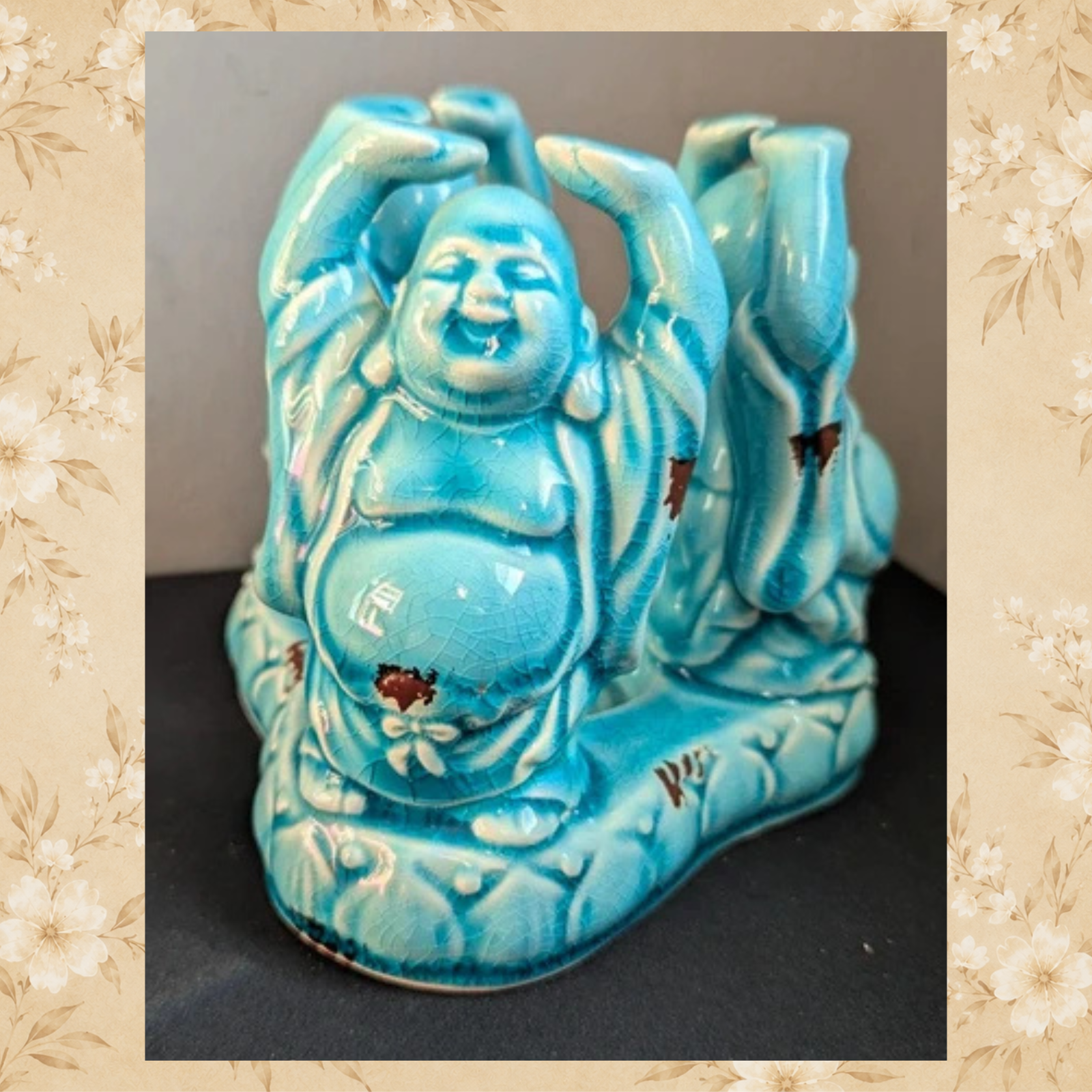 Vintage turquoise Laughing Buddha candle holder front three-quarter view
