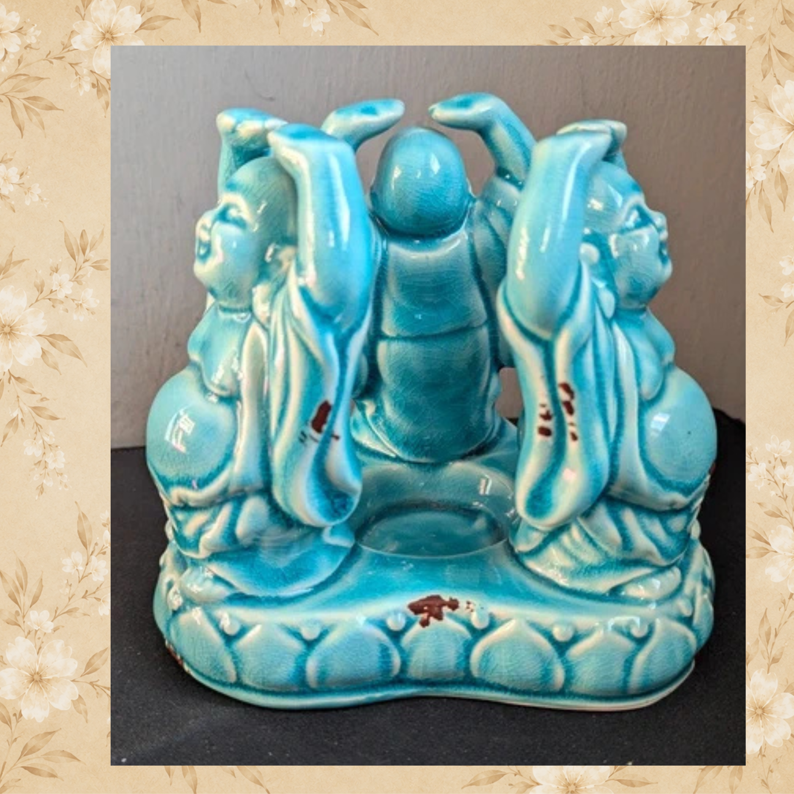 Back view of turquoise crackle glaze Laughing Buddha candle holder