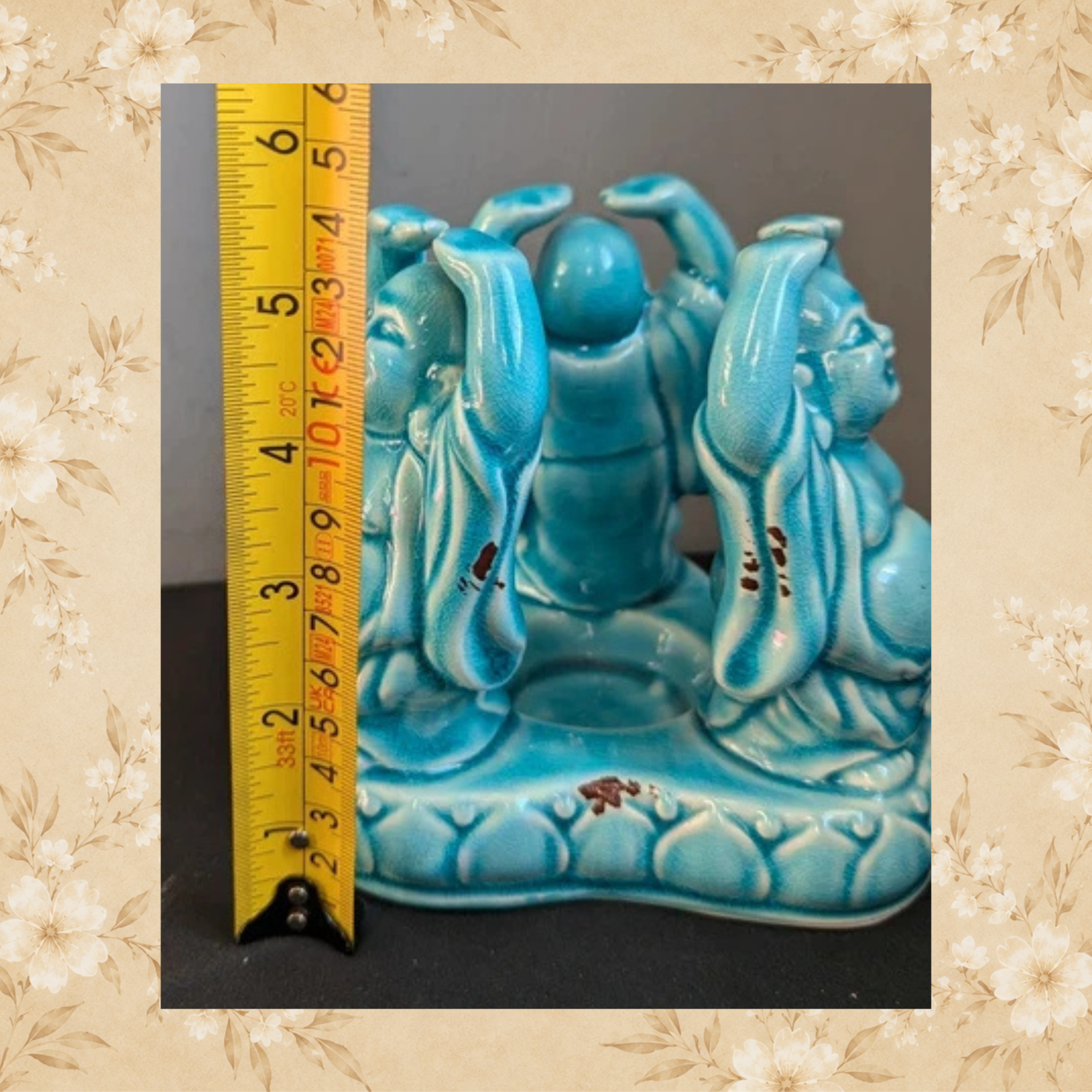 Vintage Laughing Buddha candle holder shown beside ruler for scale