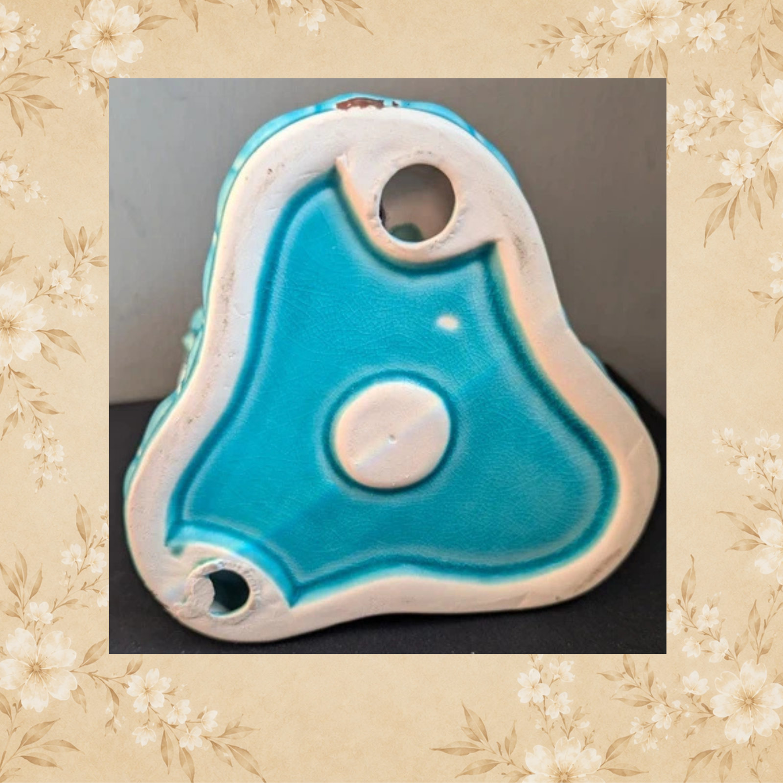 Base of vintage turquoise Laughing Buddha candle holder with recessed centre
