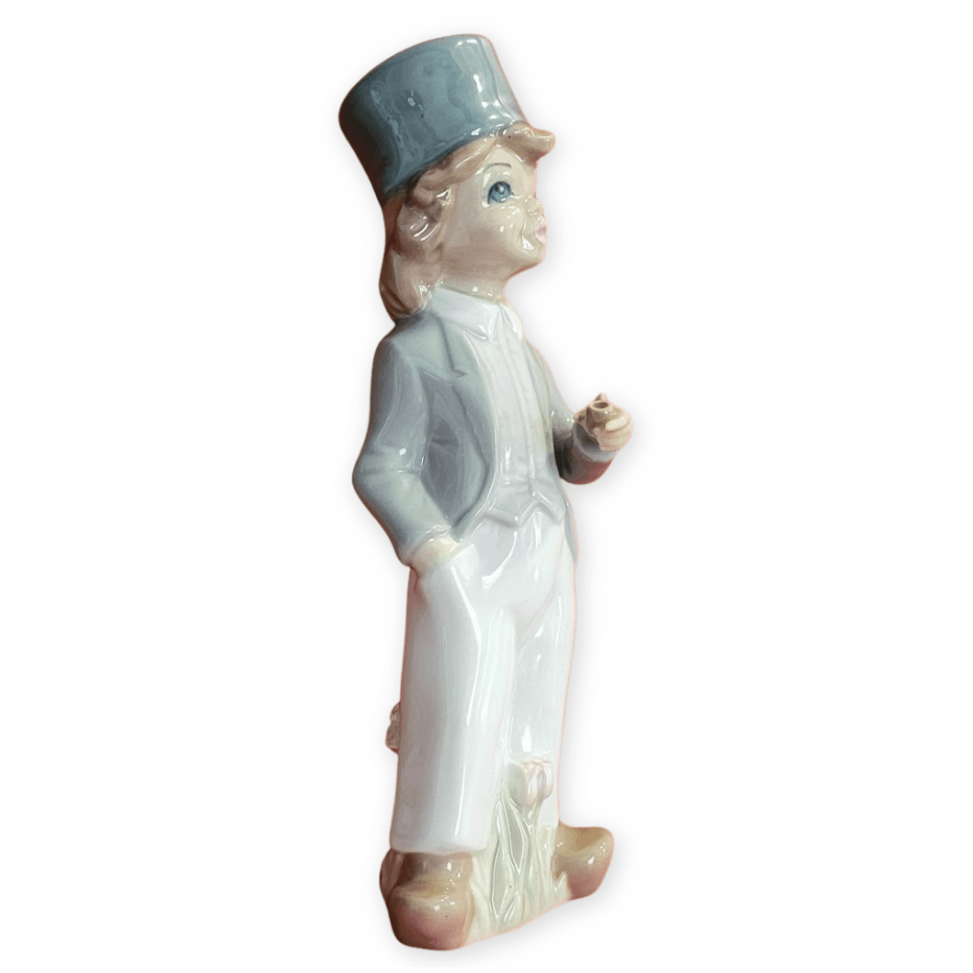 Angled view of the Casades boy with the pipe bowl visible and his right hand in his pocket