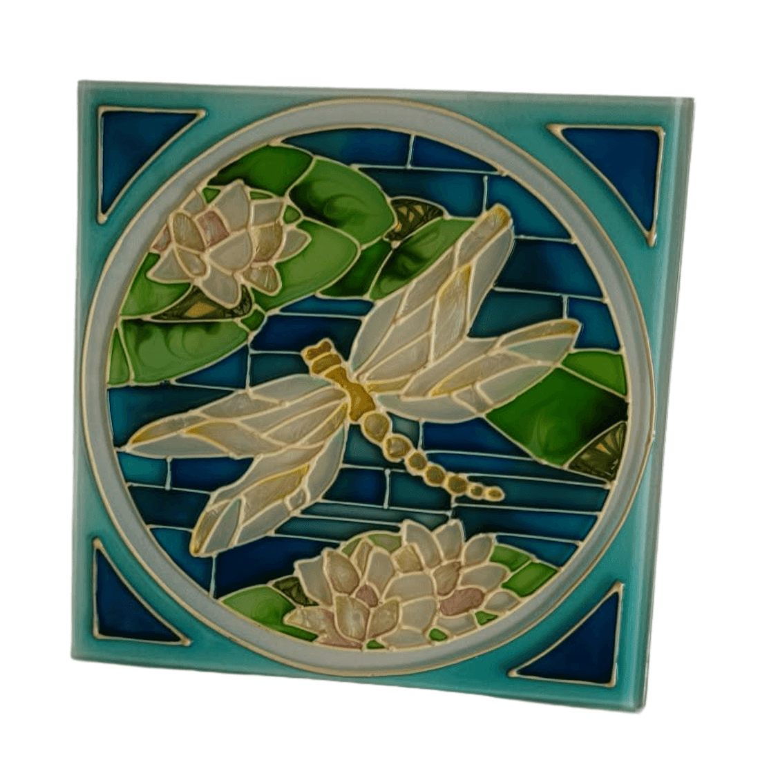 Angled front view of the blue and green dragonfly glass plaque with raised decorative outlines