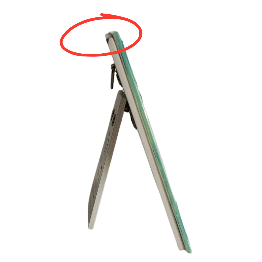 Side view of the glass plaque with its stand open and minor upper backing covering wear circled in red