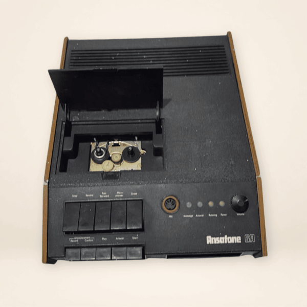 Vintage Ansafone 6A answering machine viewed from above with tape mechanism cover open