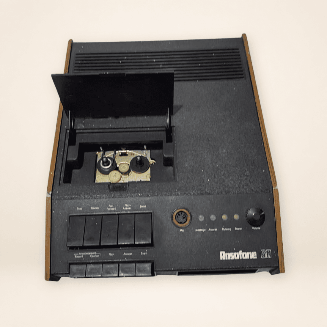 Vintage Ansafone 6A answering machine viewed from above with tape mechanism cover open