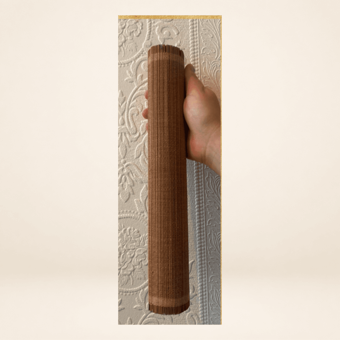 Rolled side view of vintage bamboo wall hanging showing the woven construction