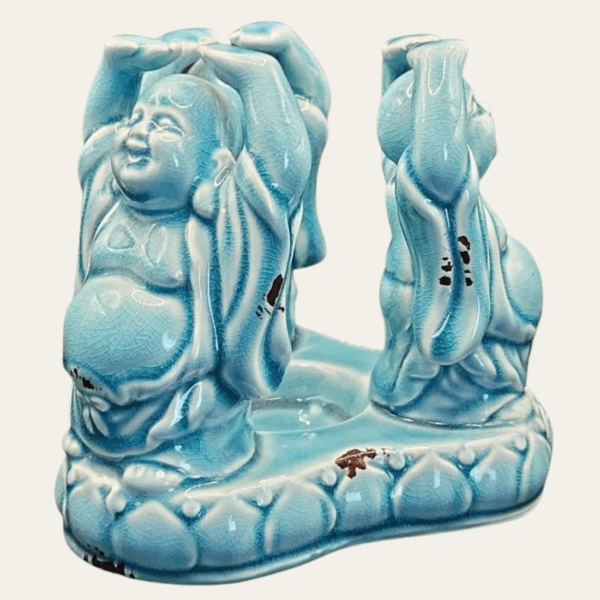Vintage Buddha candle holder in turquoise crackle glaze shown from the side