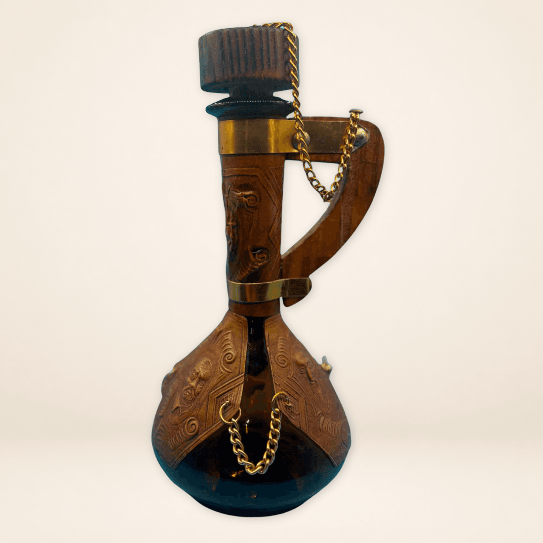 Vintage Spanish leather decanter with amber glass, embossed brown leather and gold-tone chains