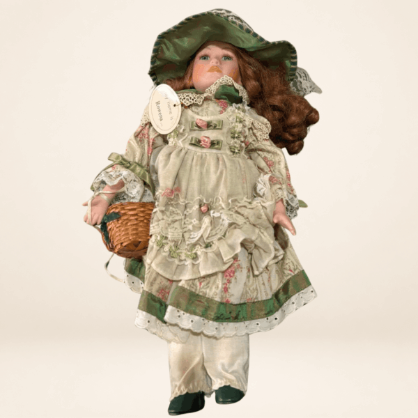 Vintage porcelain doll Rowena by The Leonardo Collection in a green floral dress