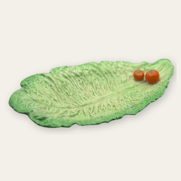 Antique Carlton Ware lettuce and tomato tray in green glaze, three-quarter view.