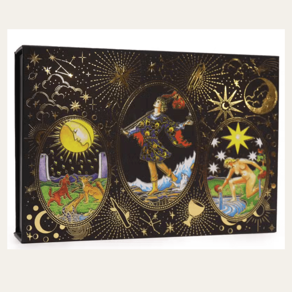 Black and gold tarot deck gift set presentation box with celestial illustrations.