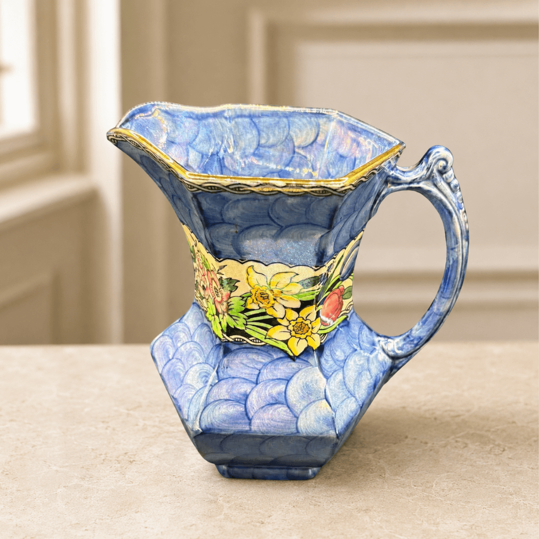 Vintage blue Maling jug displayed on a neutral interior surface