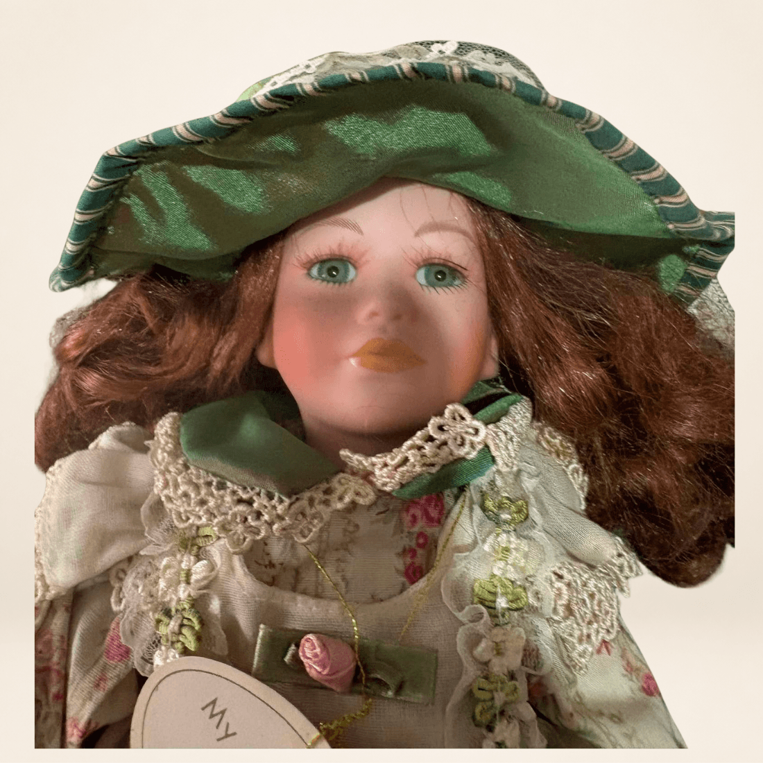 Close-up of Leonardo Collection Rowena doll with original name tag