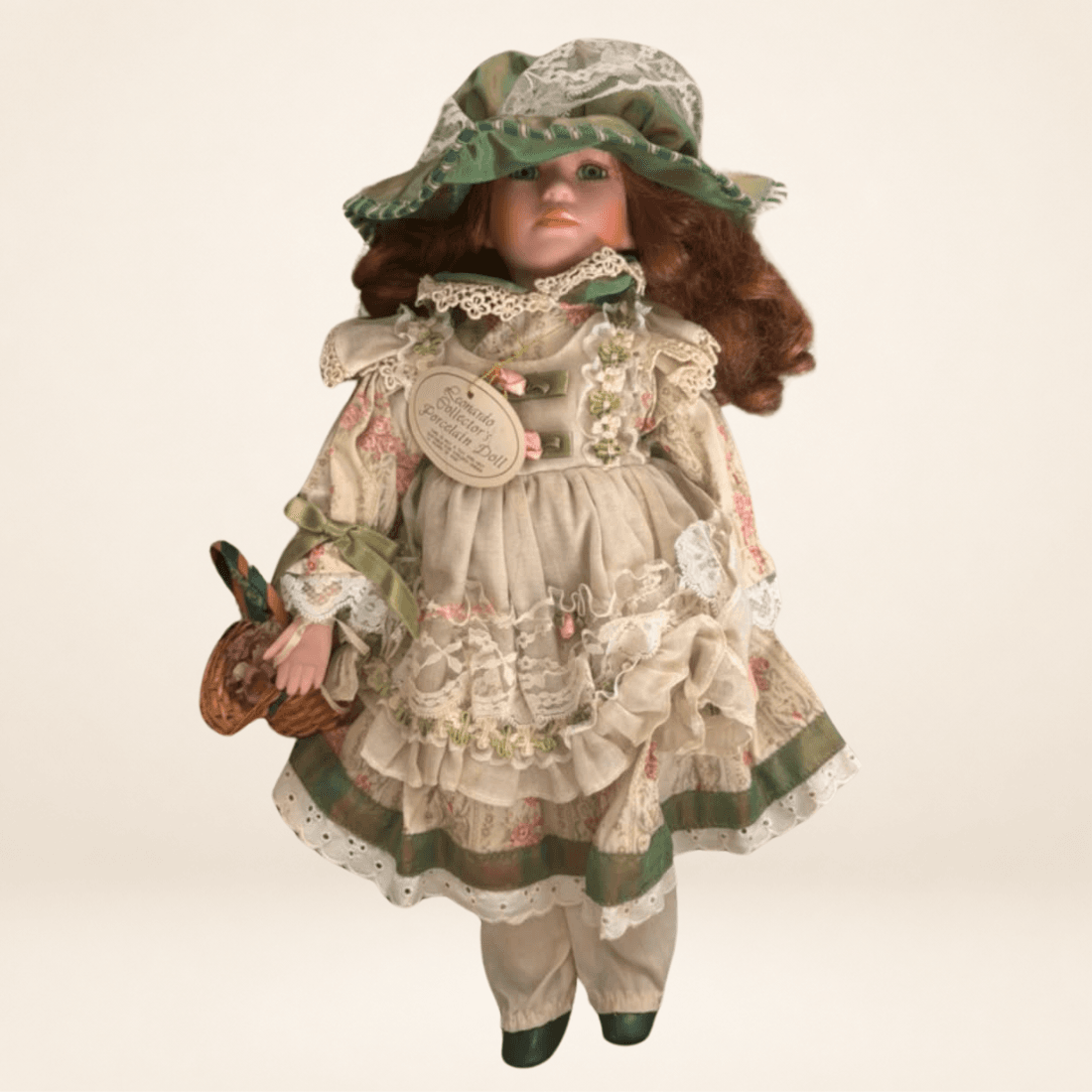 Full front view of vintage Rowena porcelain doll holding a small basket