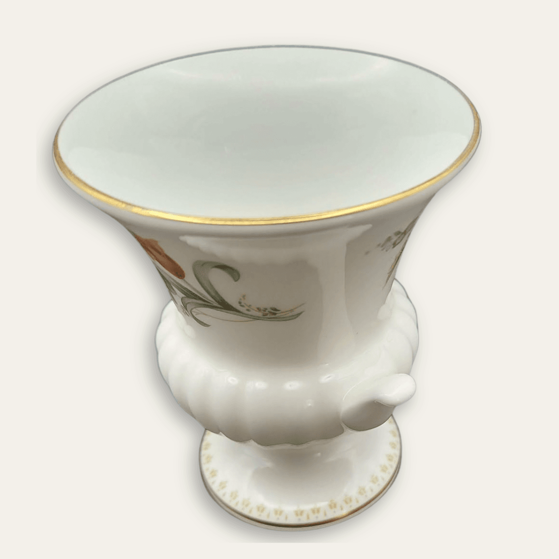 Side view of Wedgwood Mirabelle 9 cm urn vase showing floral motif and handle
